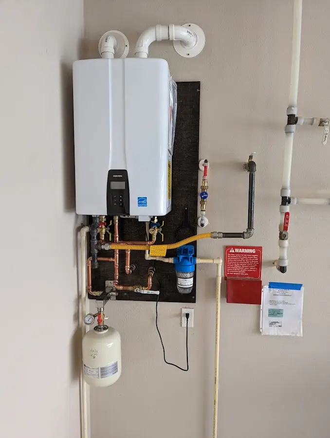 Professional plumber installing copper piping in a Cocoa West home